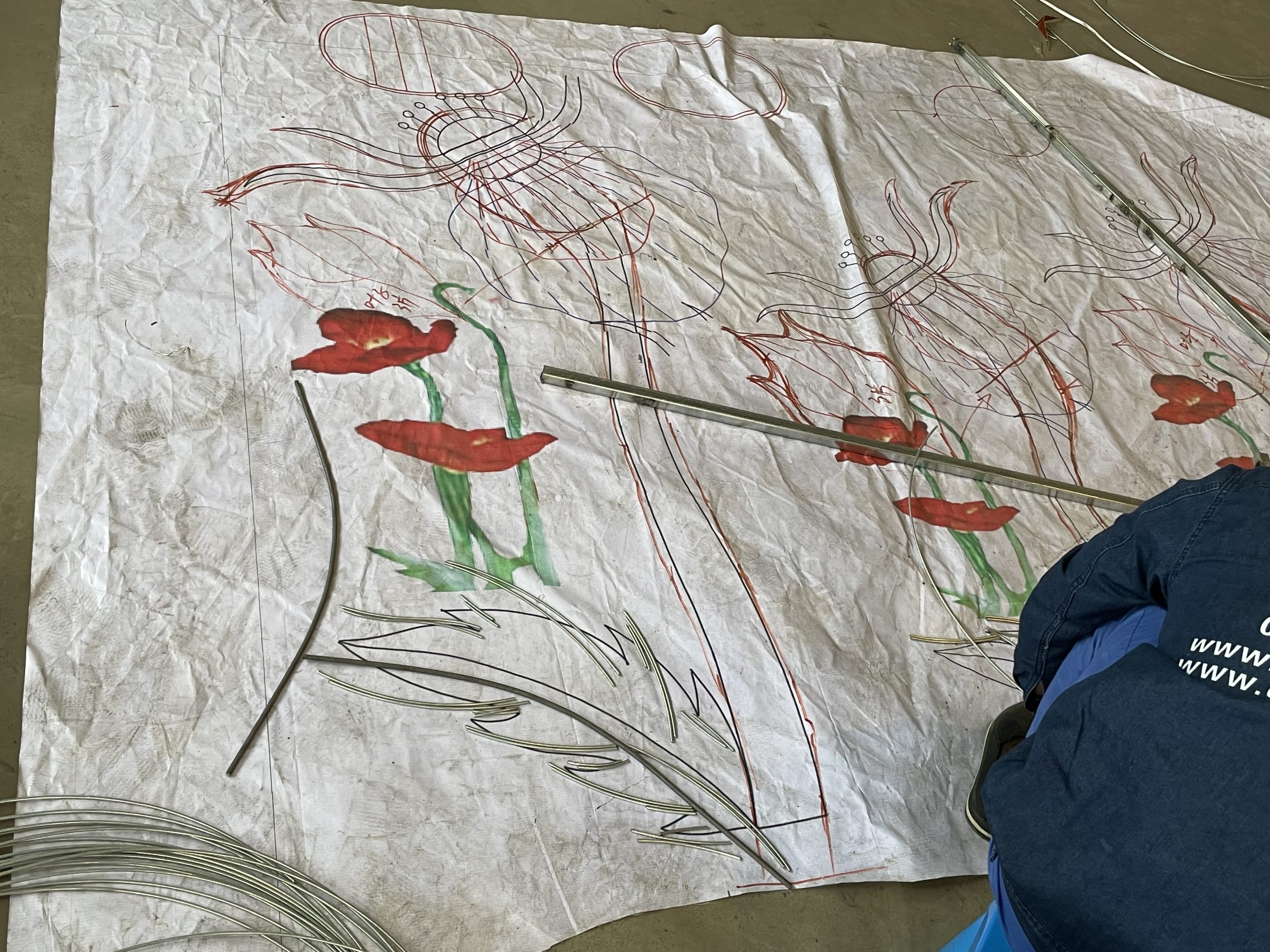 Full-size floral design outlines on a workshop pattern sheet