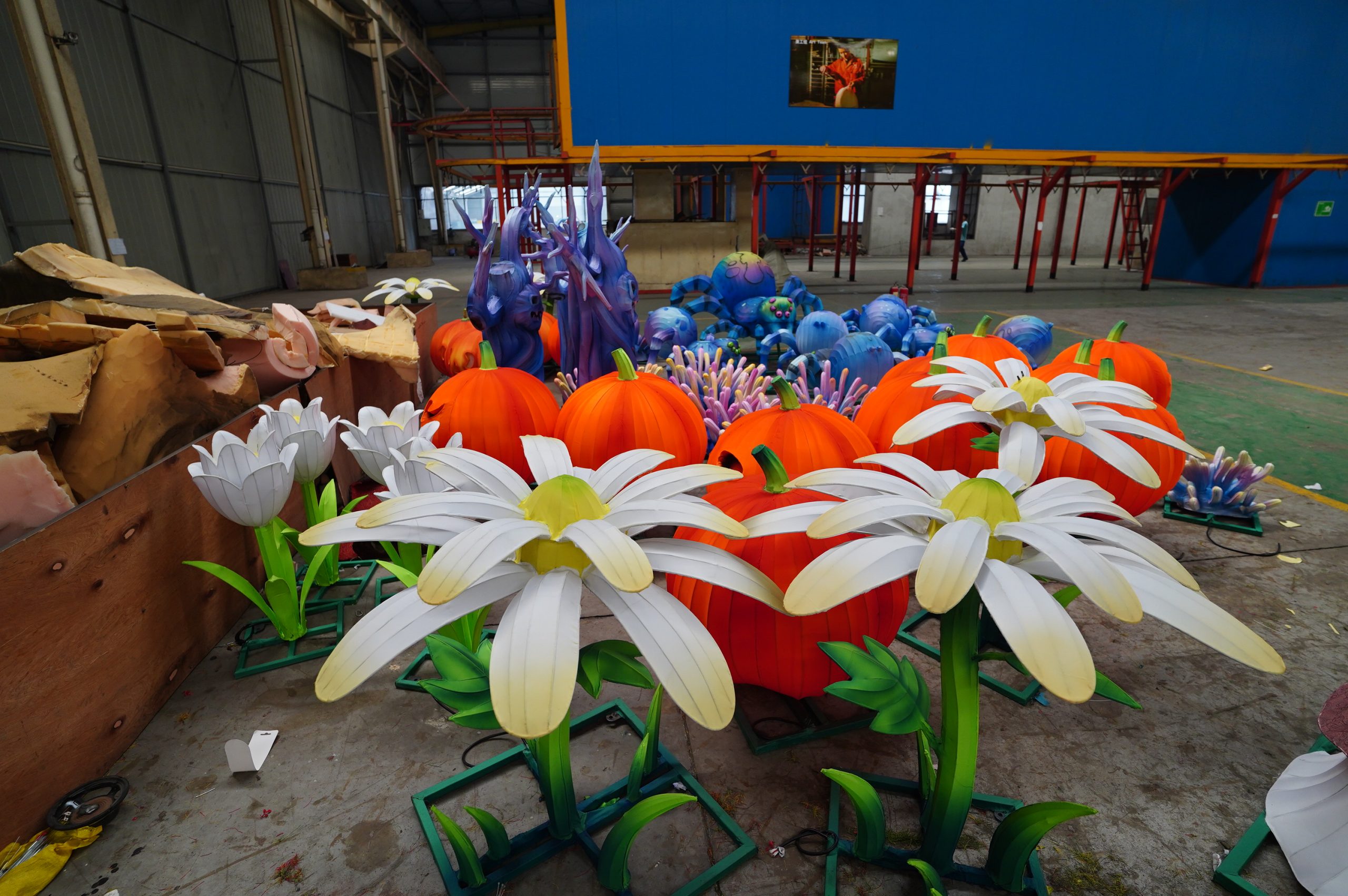 Completed daisy lantern pieces grouped in the workshop